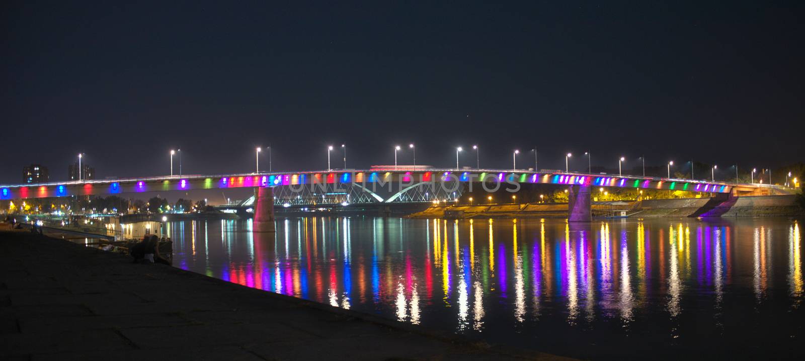 Night view on colorful bridge over Danube by sheriffkule