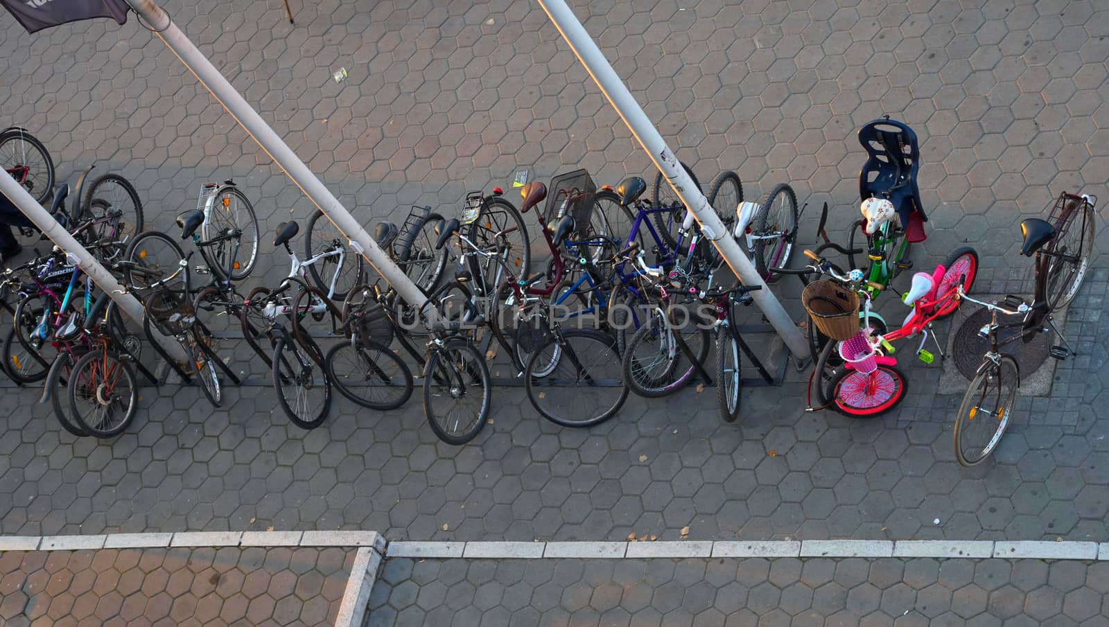 Above view on a bunch of parked bicycles by sheriffkule