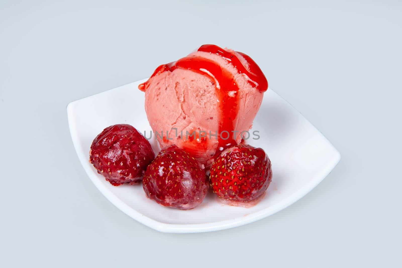 Icecream with different ingredients on a studio neutral background