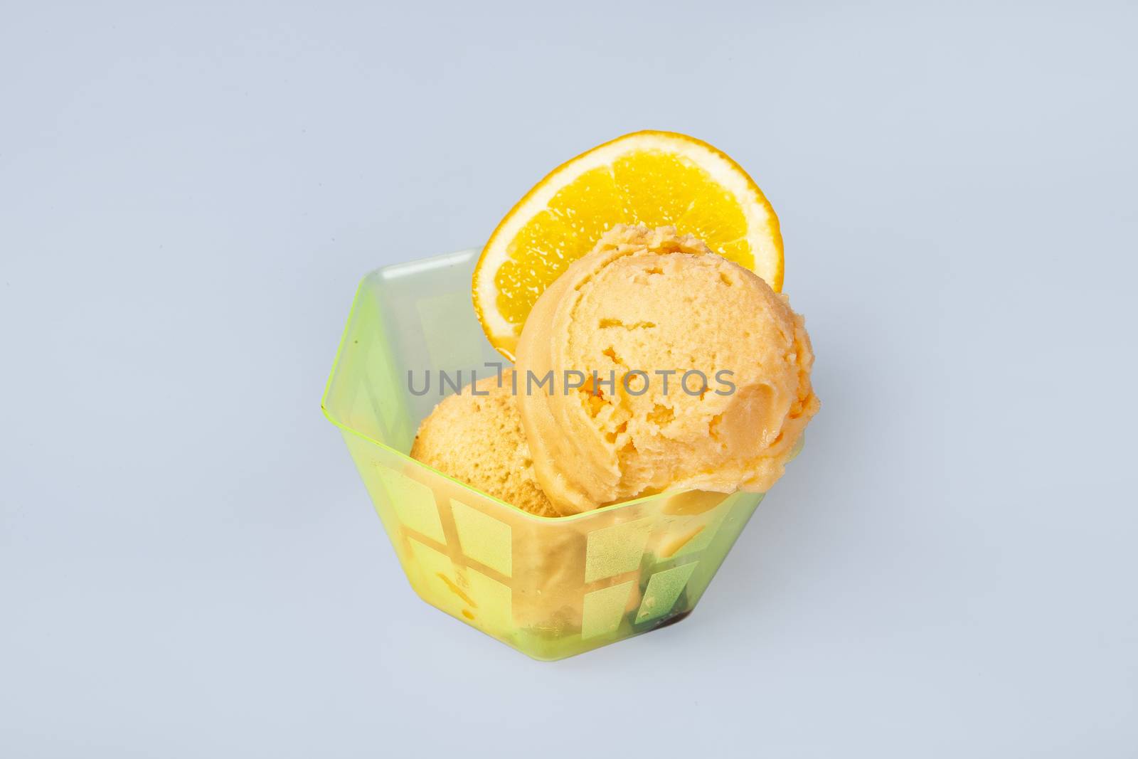 Icecream with different ingredients on a studio neutral background