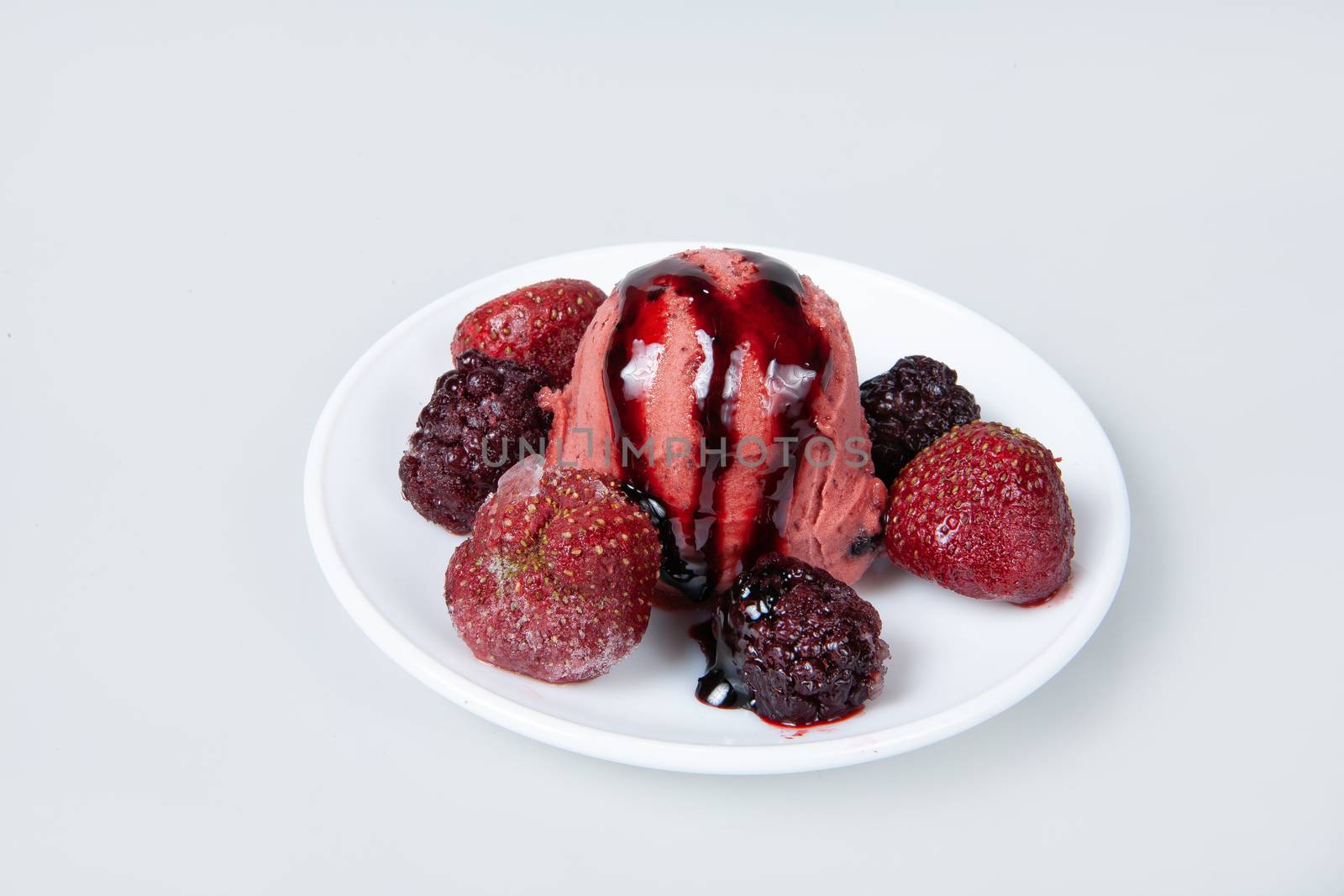 Icecream with different ingredients on a studio neutral background