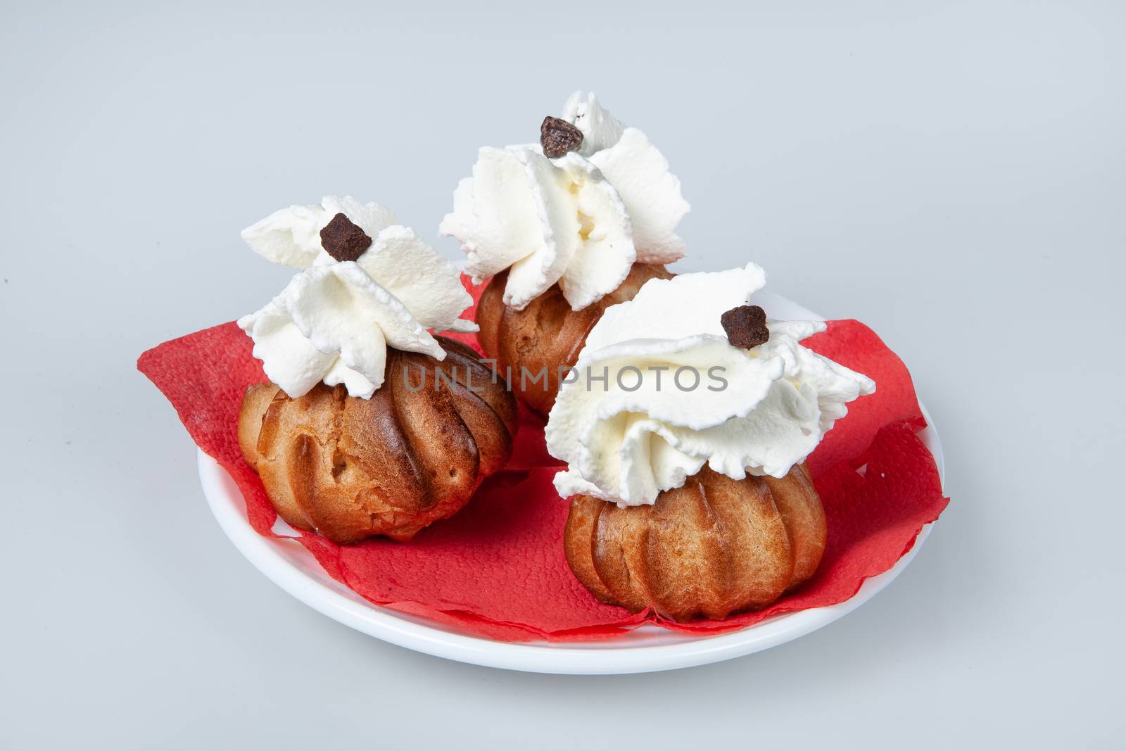 Icecream with different ingredients on a studio neutral background