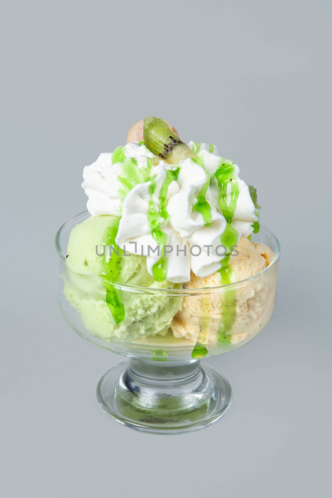 Icecream with different ingredients on a studio neutral background