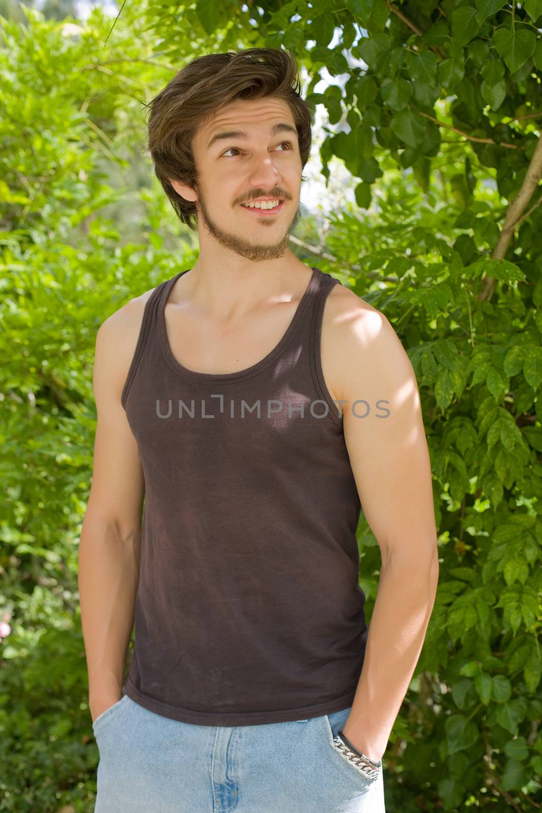 portrait of happy handsome young man, summer outdoors.