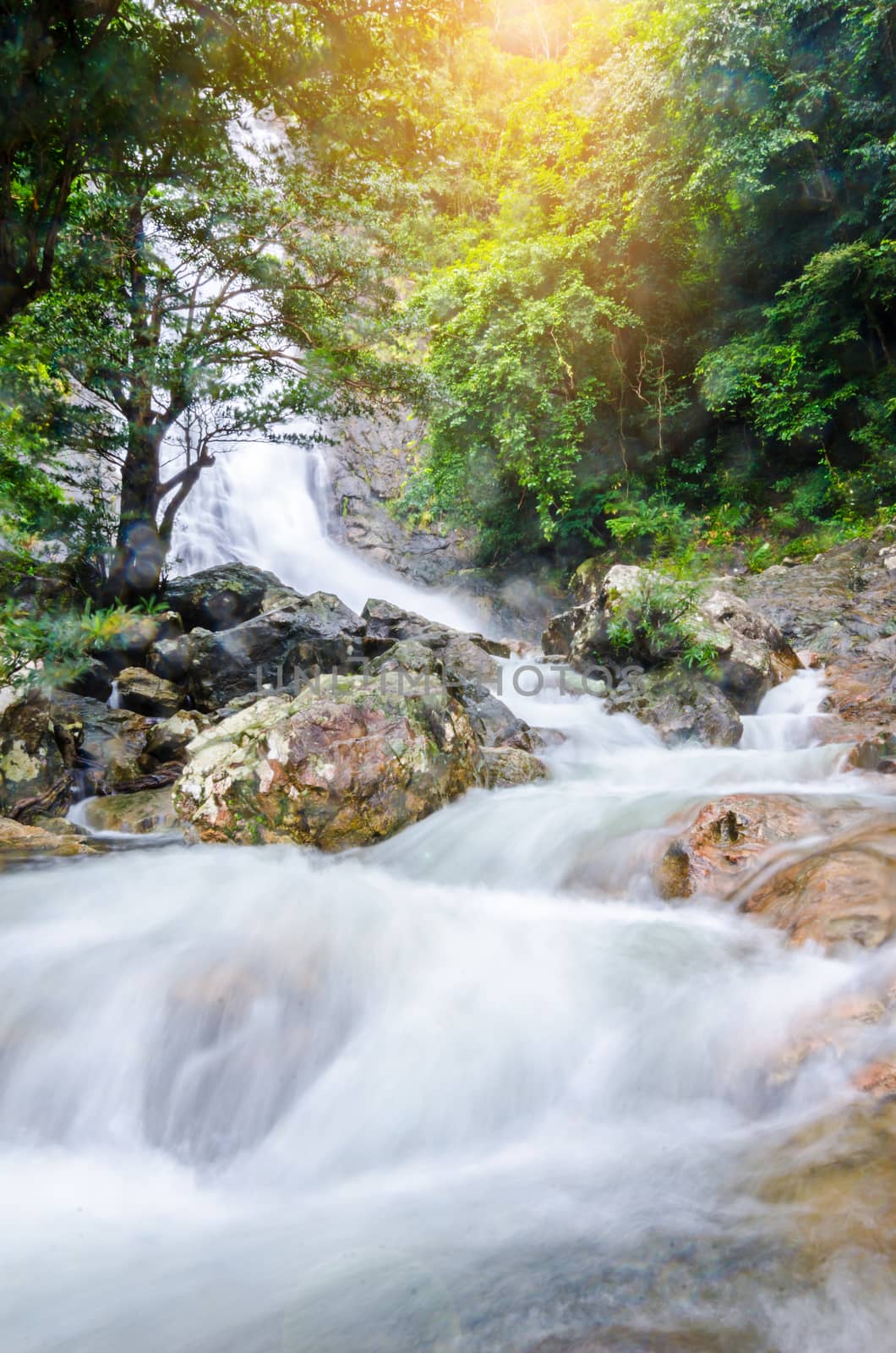 Beautiful waterfall in deep forest at Thailand. by Gamjai