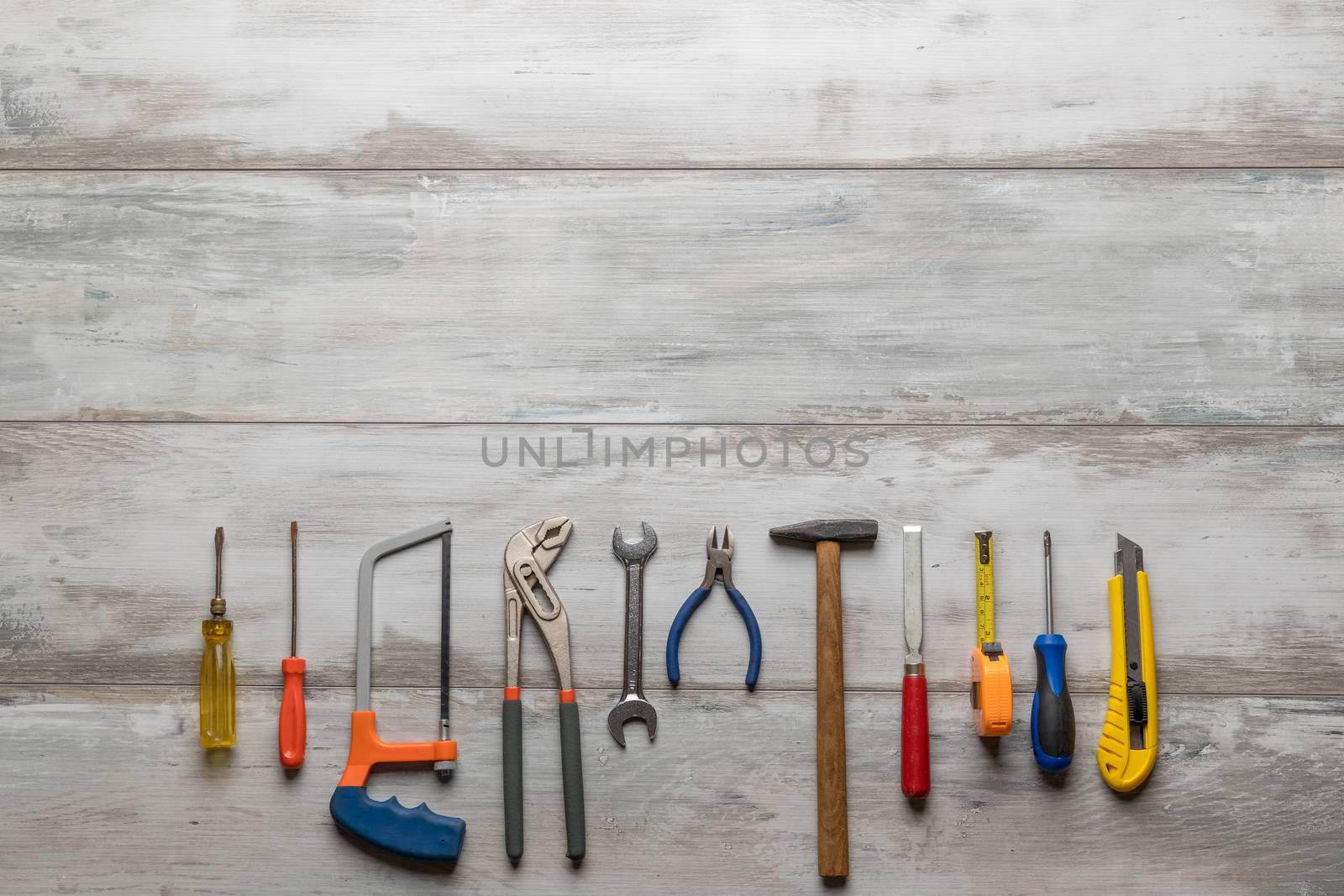 construction tools on gray wooden by Robertobinetti70