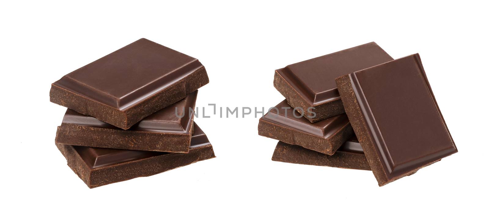 Dark chocolate bars isolated on white background with clipping path, stack of chocolate pieces, closeup