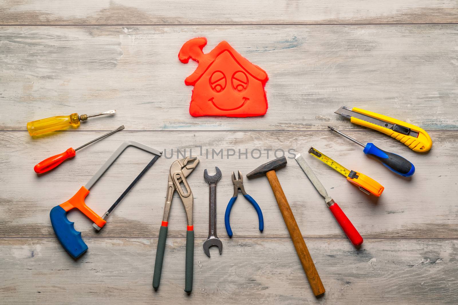 Set of work tool on rustic wooden background with icon of house in space, industry engineer tool concept.still-life.