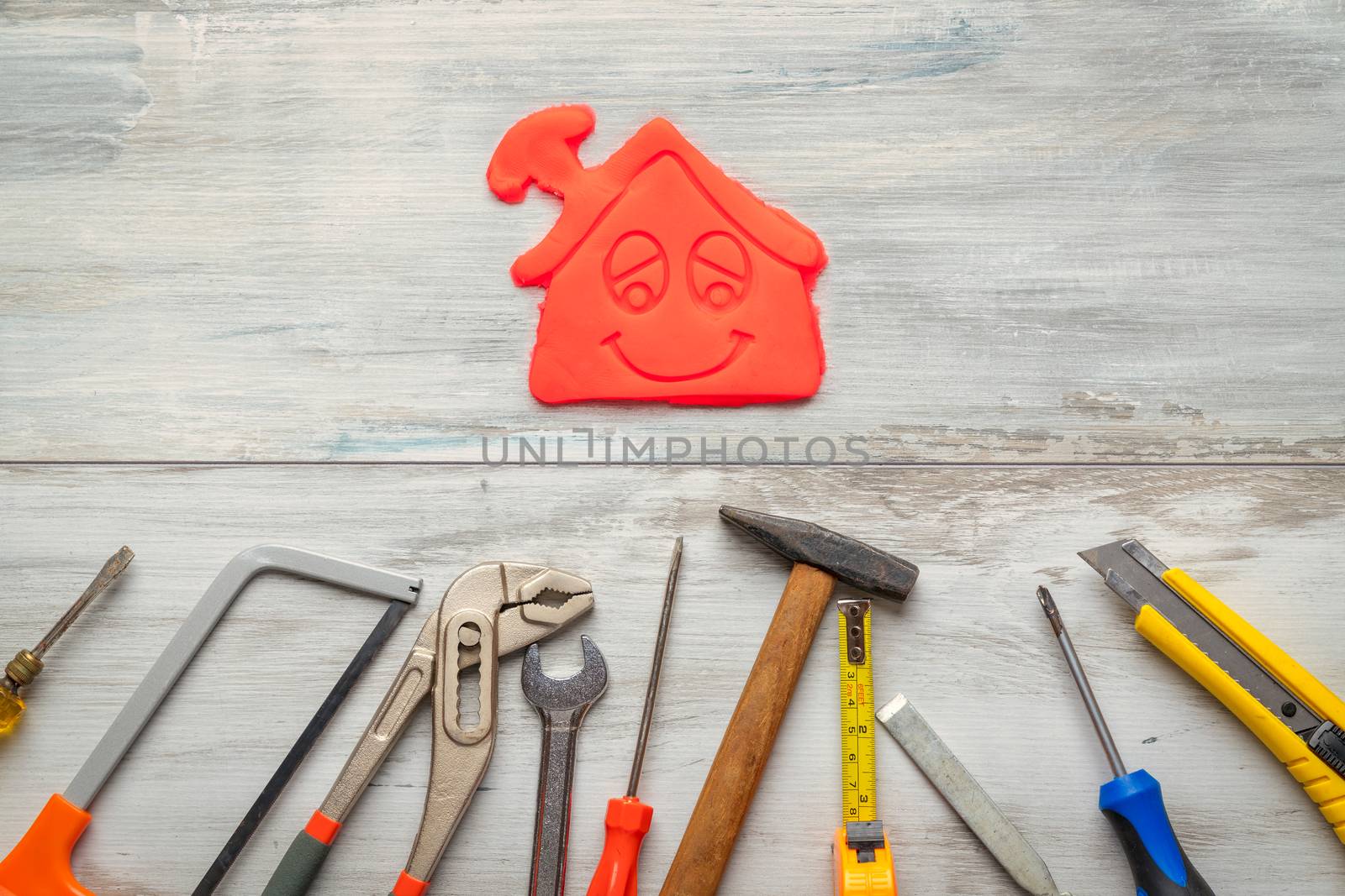 Set of work tool on rustic wooden background with icon of house in space, industry engineer tool concept.still-life.