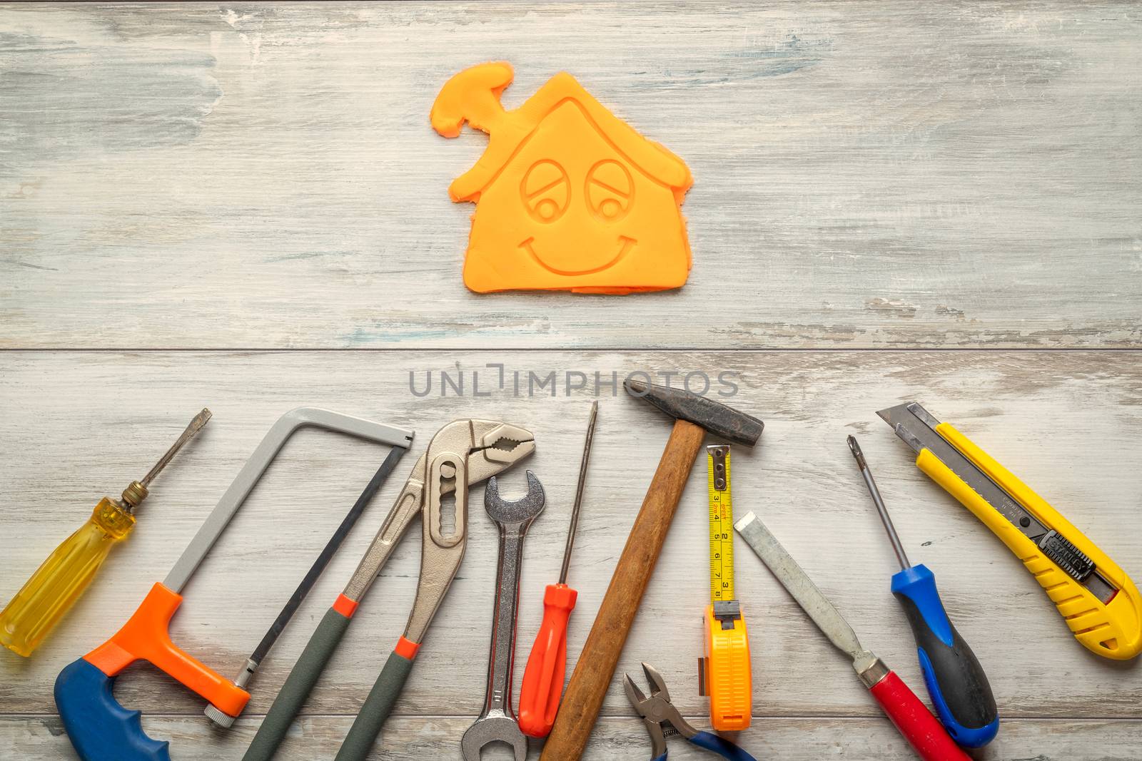 Set of work tool on rustic wooden background with icon of house in space, industry engineer tool concept.still-life.