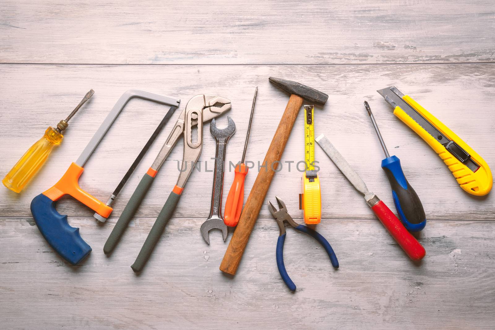 construction toolkit on wooden close up by Robertobinetti70