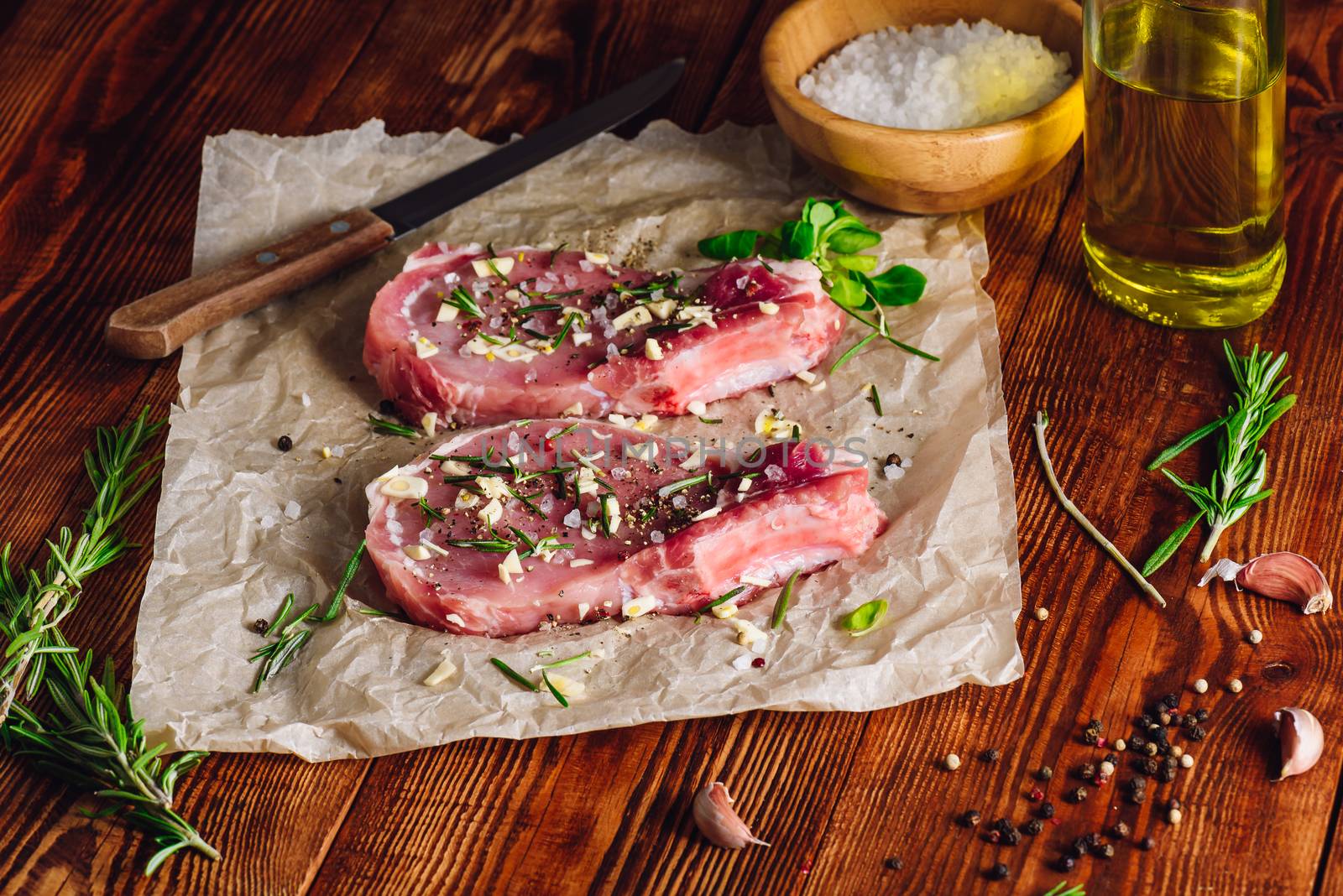 Two Rib-Eye Steaks Prepared with Rosemary for Roasting