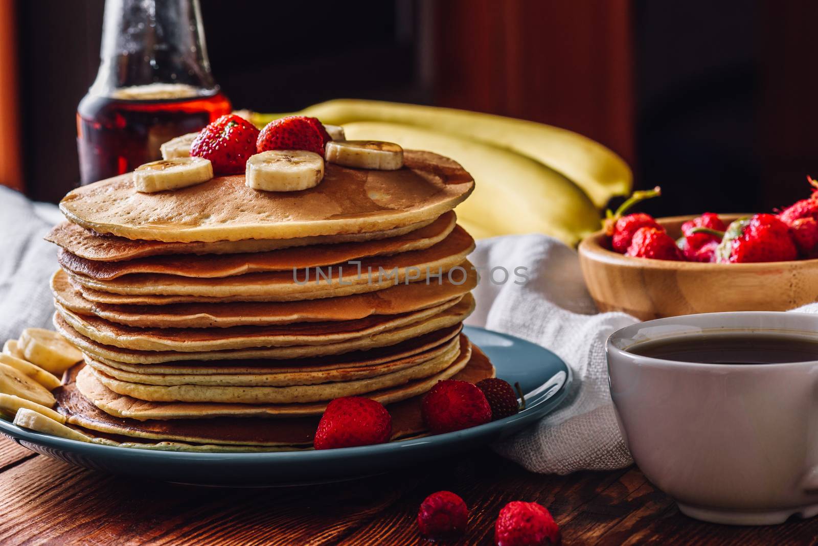 Pancakes Stack with Tea Cup and Fruits.
