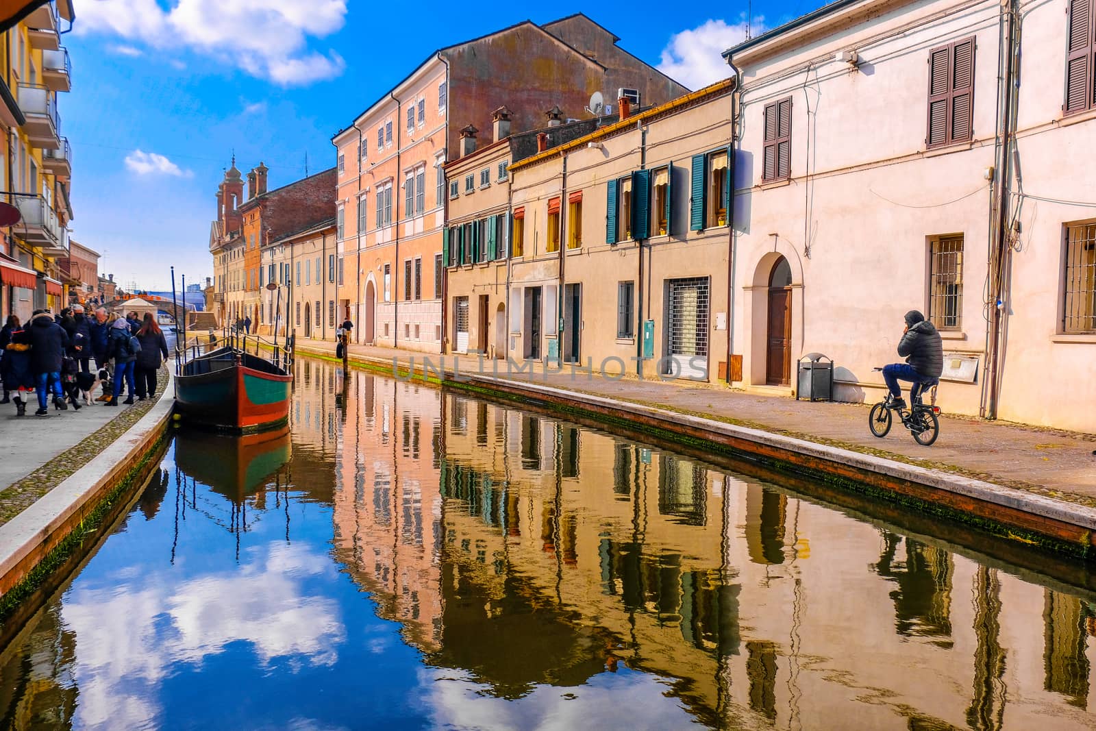 Comacchio vale Ferrara province Emilia Romagna region cycling in Italy blue sky over canal by LucaLorenzelli