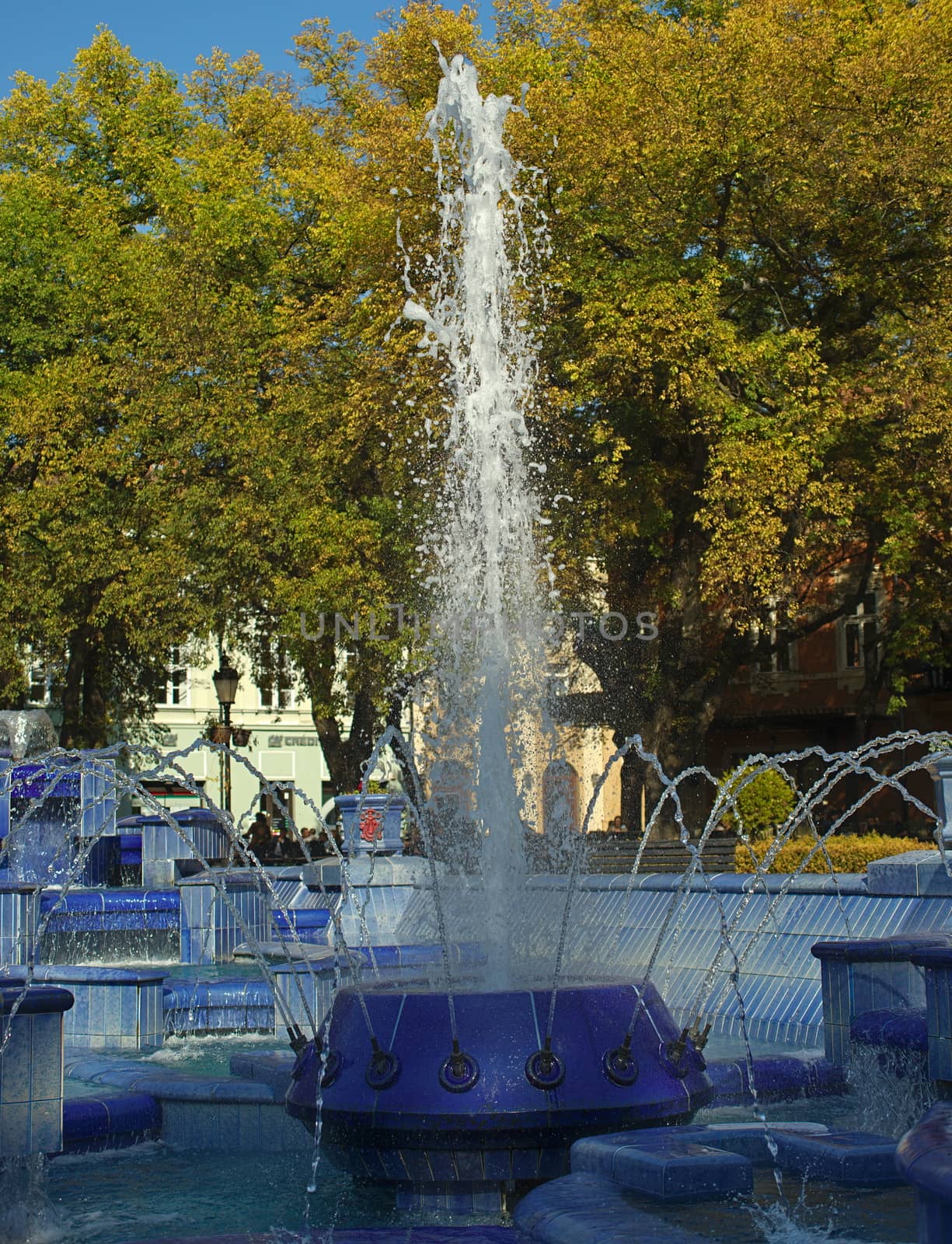 Fountain made of blue marble with water splashing around