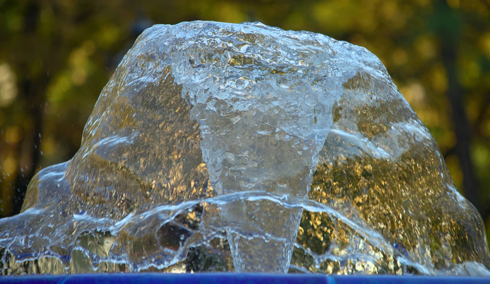 Jet of water spraying and splashing from a fountain