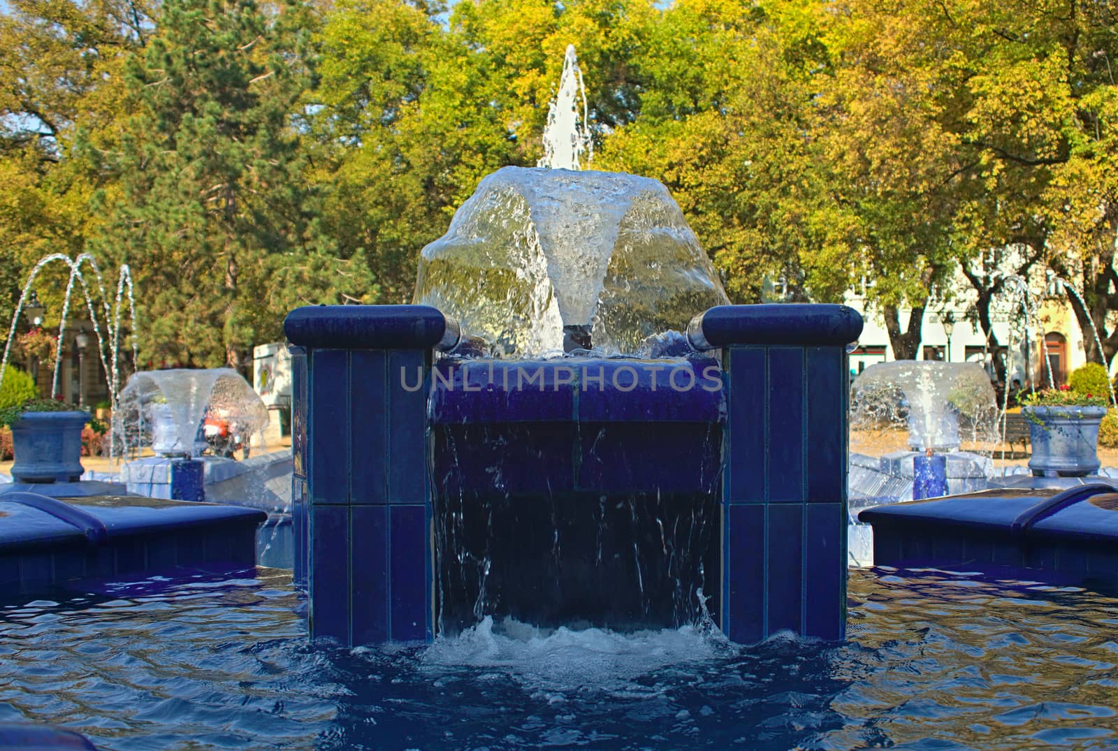 Fountain made of blue marble with water splashing around