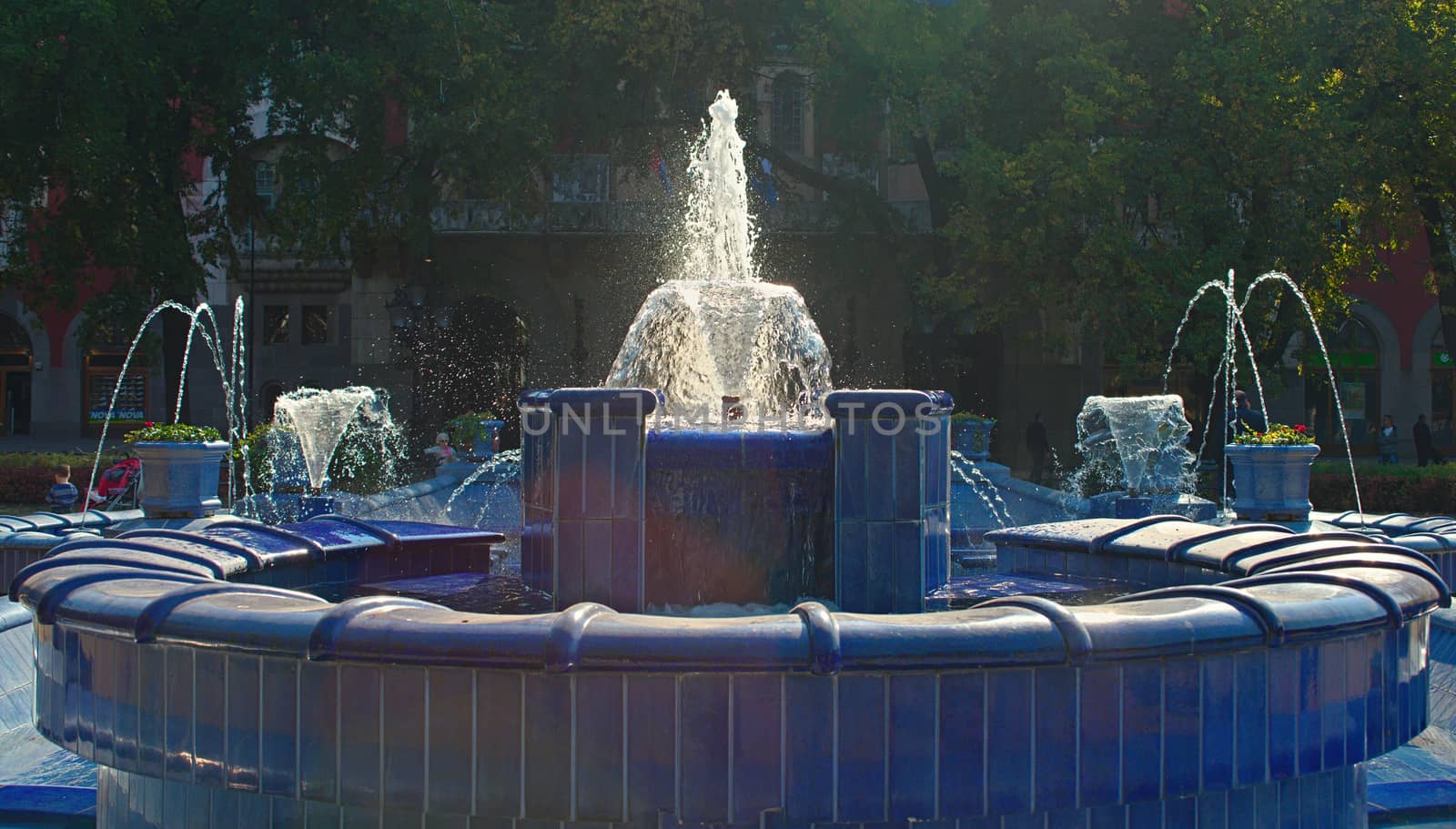 Fountain made of blue marble with water splashing around