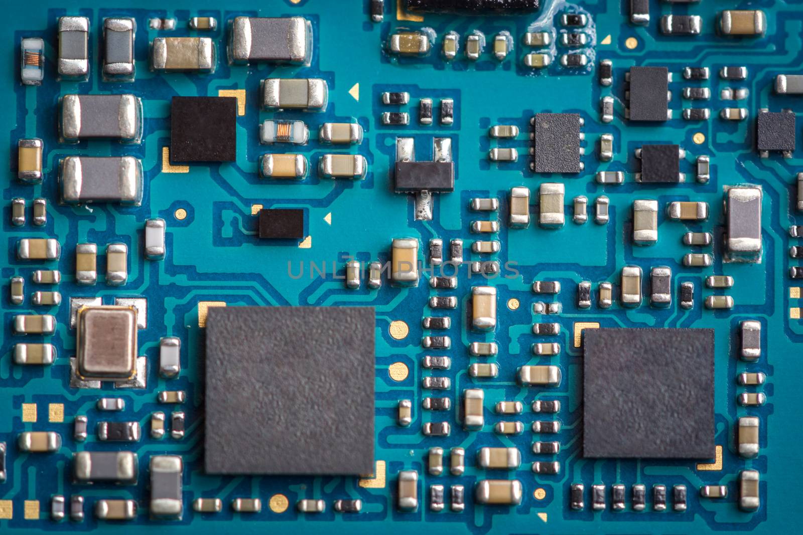 Close up zoom shot of mobile phone mother board with microchips and circuits. For phone repair service or center.