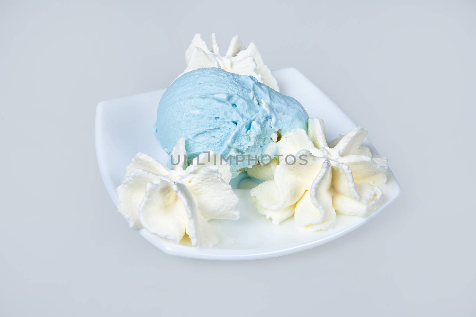 Icecream with different ingredients on a studio neutral background