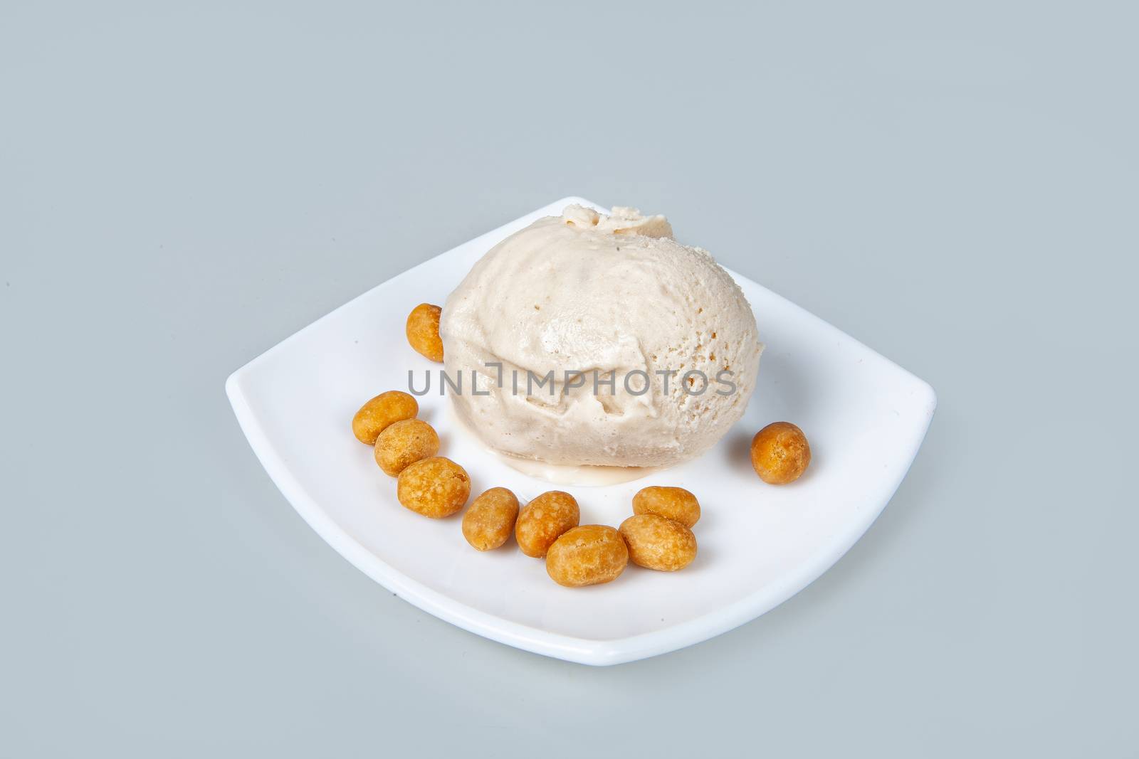 Icecream with different ingredients on a studio neutral background