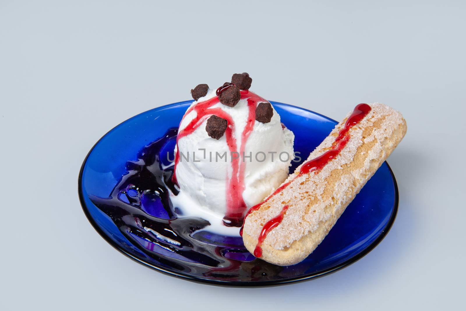 Icecream with different ingredients on a studio neutral background