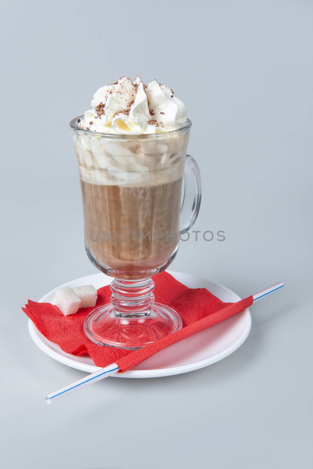 Glass with coffee< milk and cream on a studio background