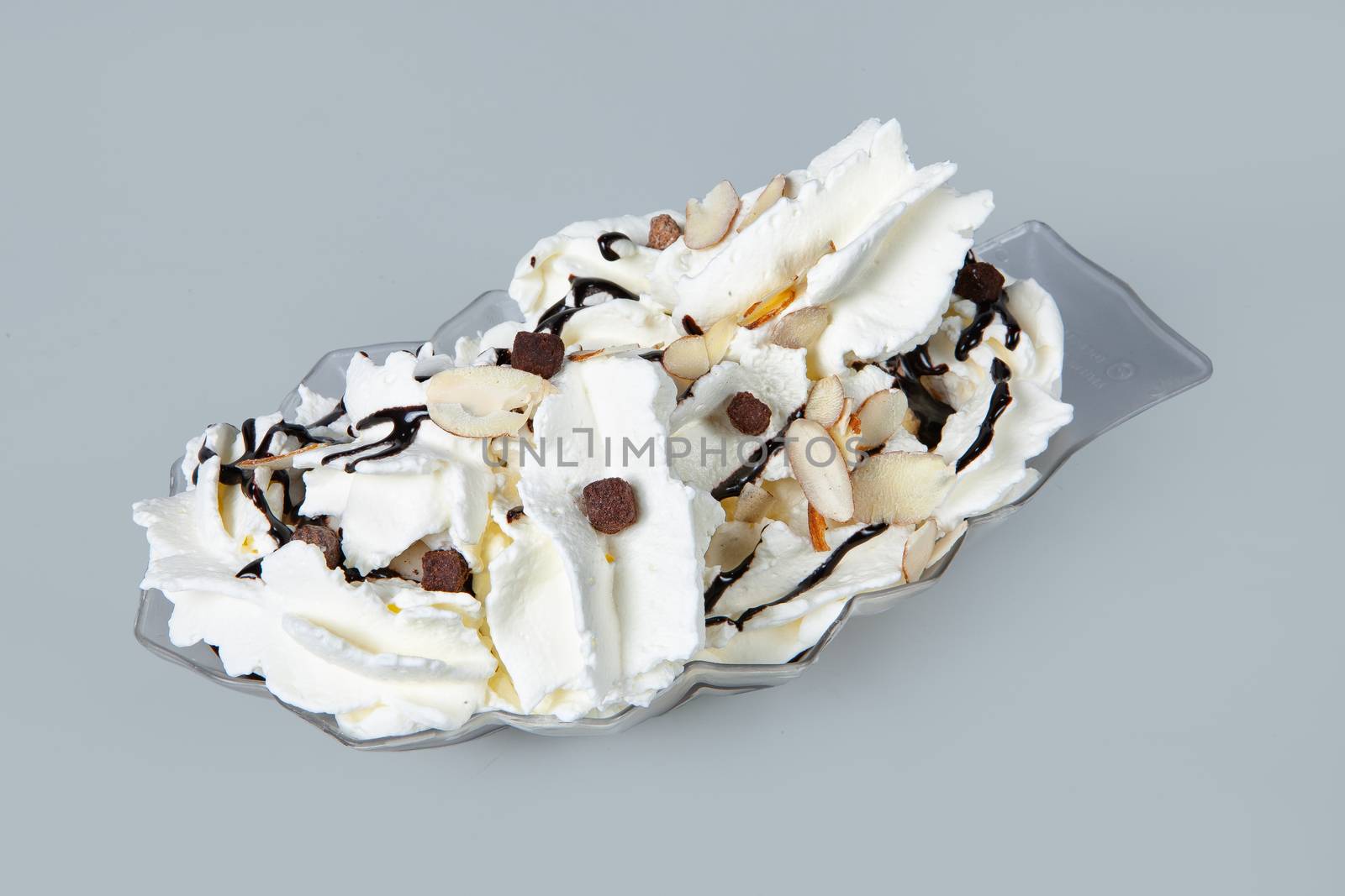 Icecream with different ingredients on a studio neutral background