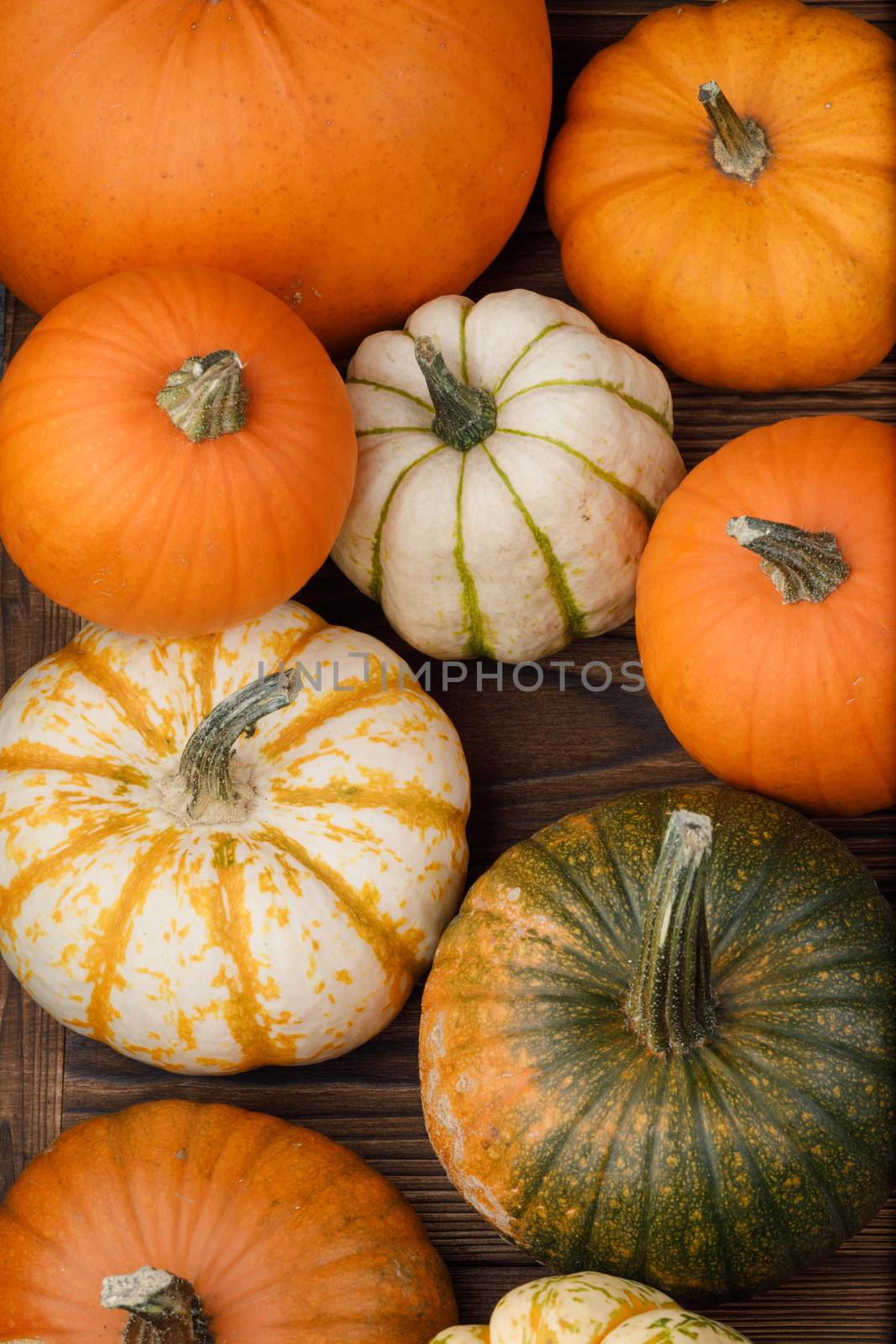 Many orange pumpkins on wooden background , Halloween concept