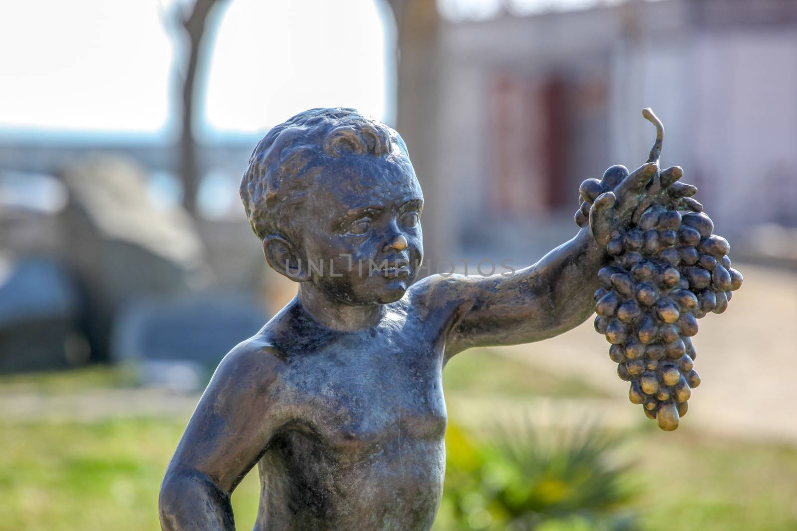 Pomorie, Bulgaria - March 02, 2019: "The Boy with Grapes" - The Statue Symbol Of The Town Of Pomorie. by nenovbrothers