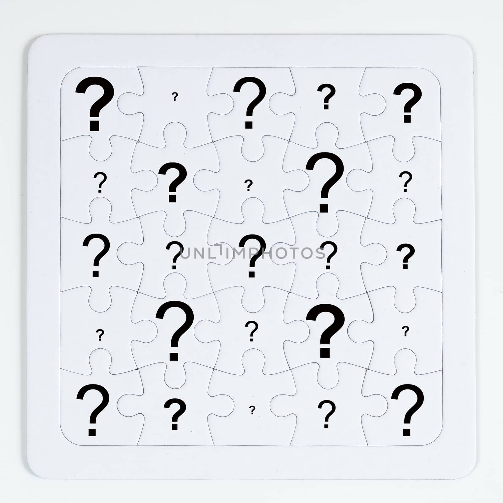 a puzzle with white pieces with an question mark