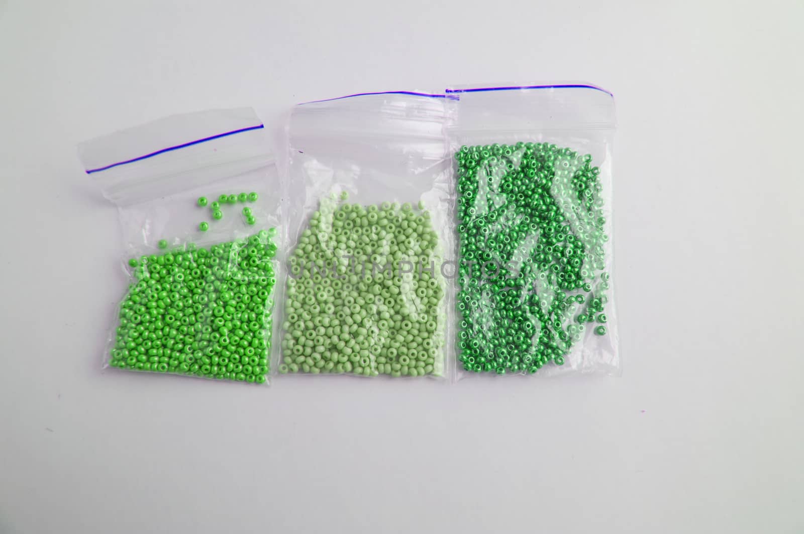 Set of multi-colored beads and beads in a mini plastic bag for embroidery needlework by claire_lucia