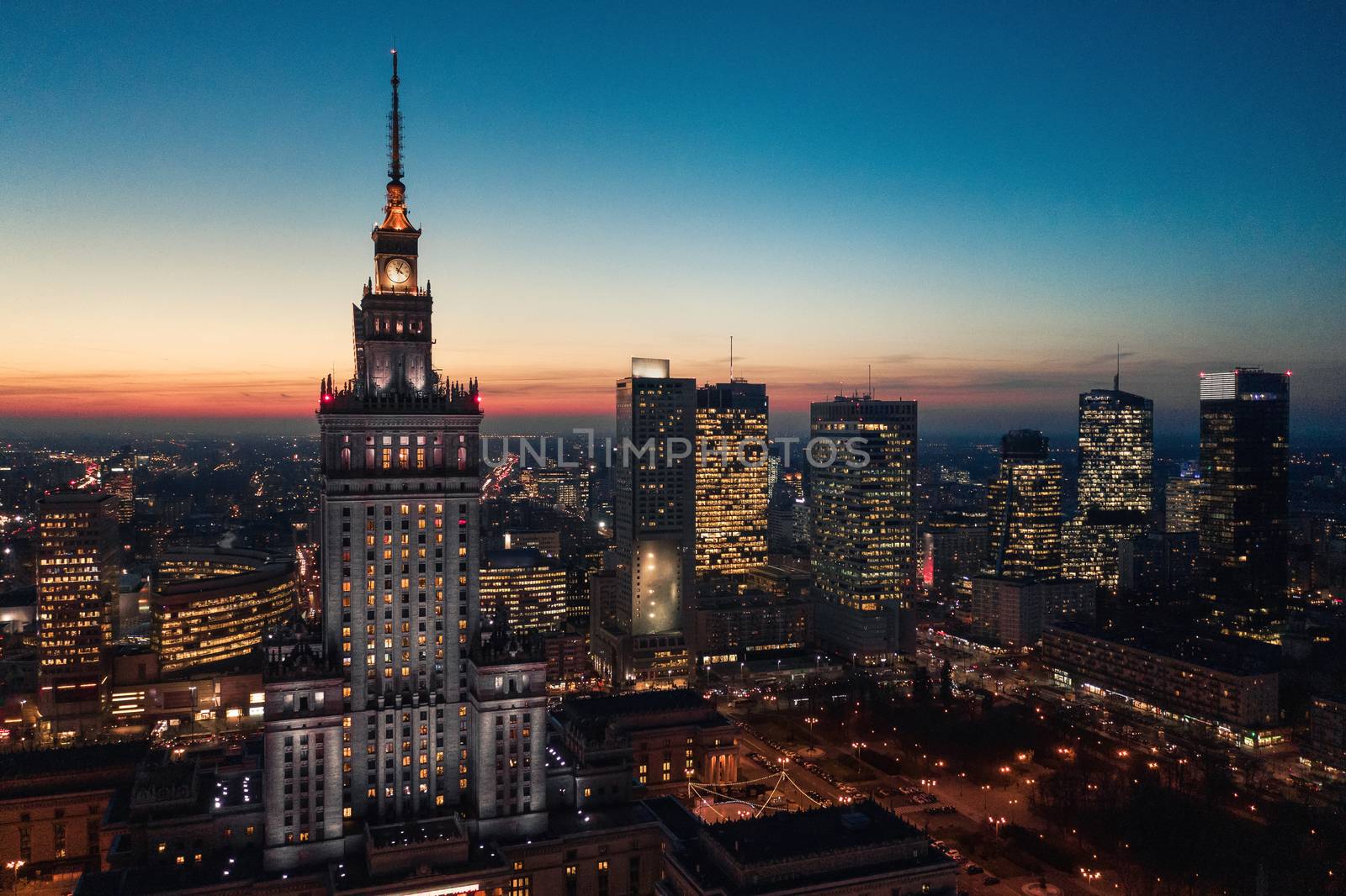 Aerial view of Warsaw business center: Palace of Science and Culture and skyscrapers at sunset