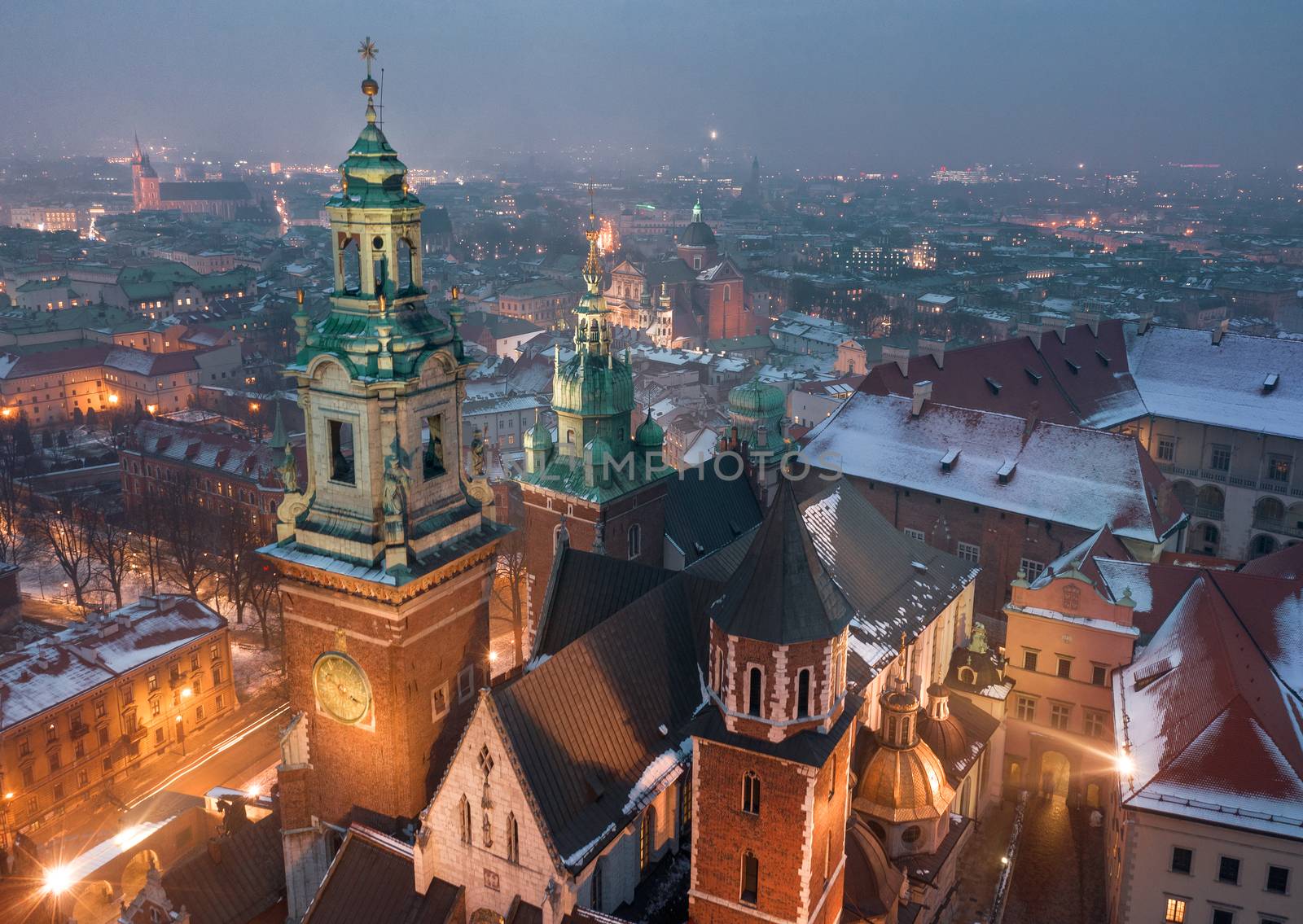 Aerial view of the historical center of Krakow, church, Wawel Royal Castle at night. Old town in winter