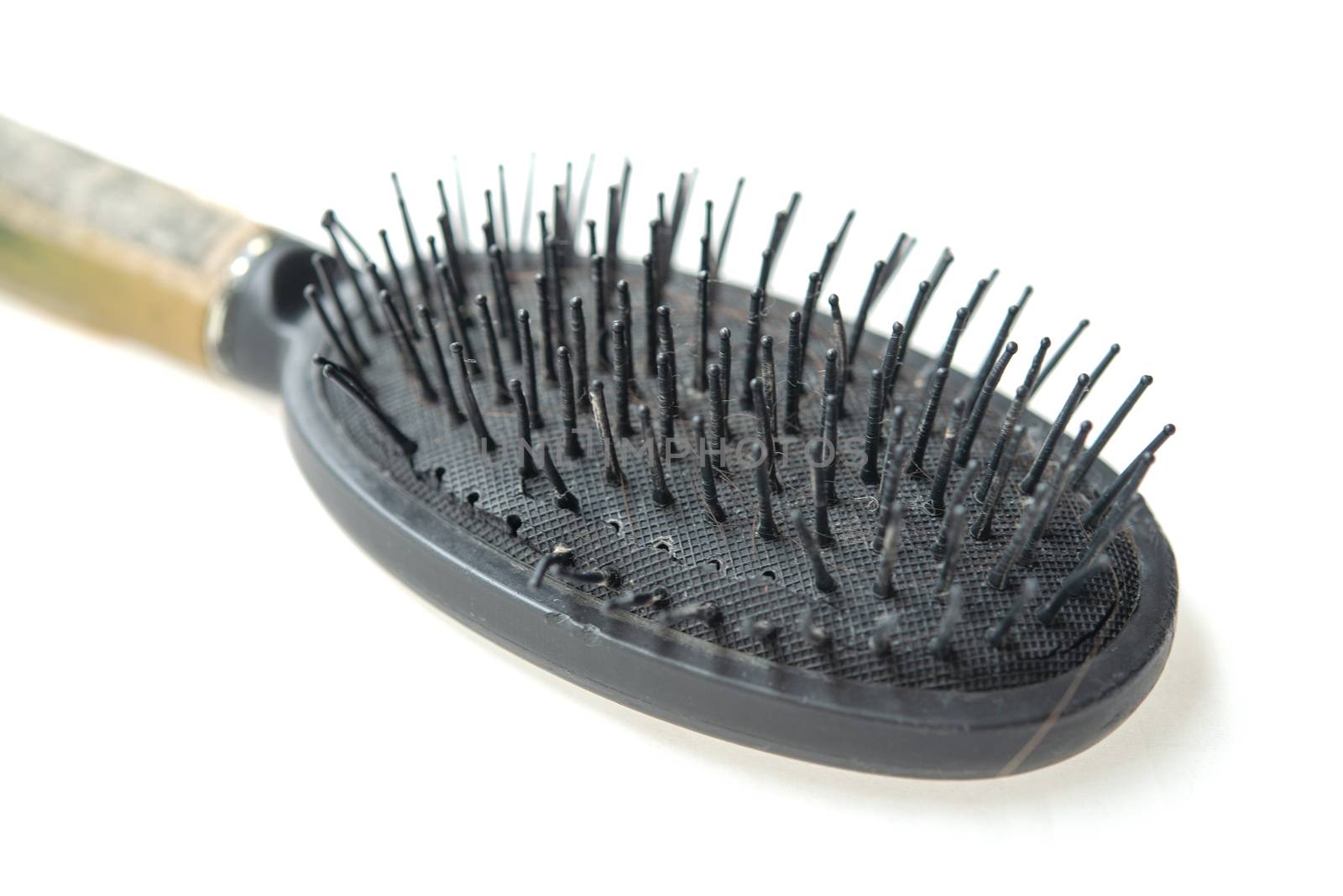 Used old dirty hair brush isolated on white background.