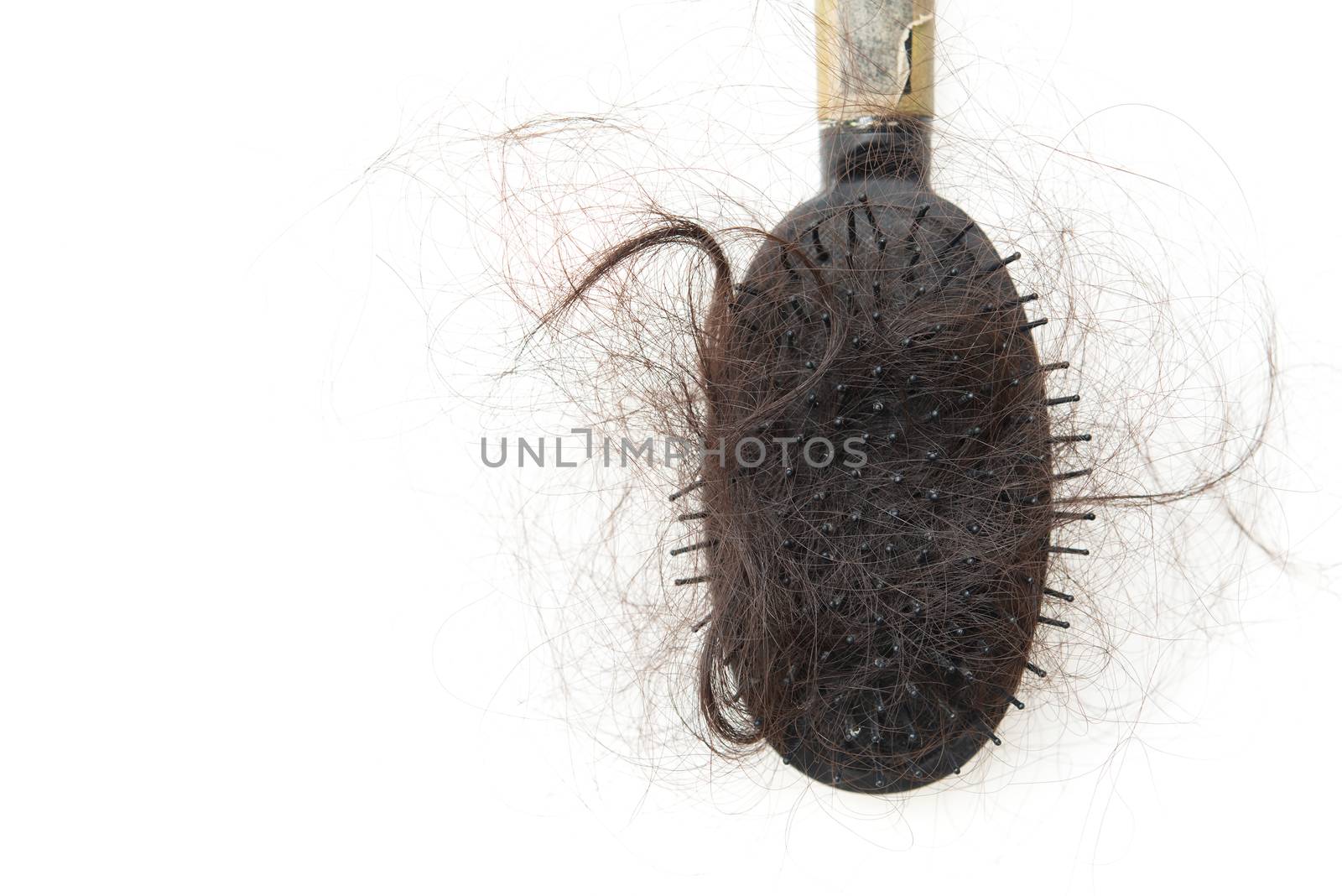 Used dirty hairbrush with lost hair on it, isolated on white background.
