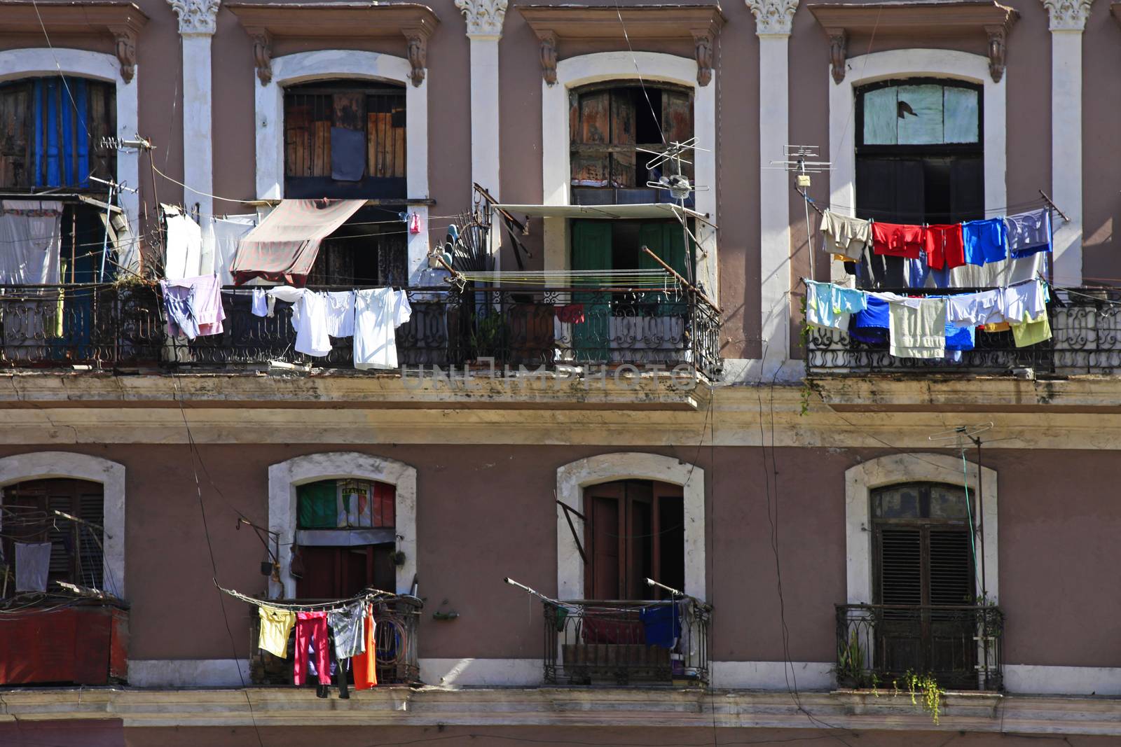 Hanging laundry to dry on balcony in Havana, Cuba