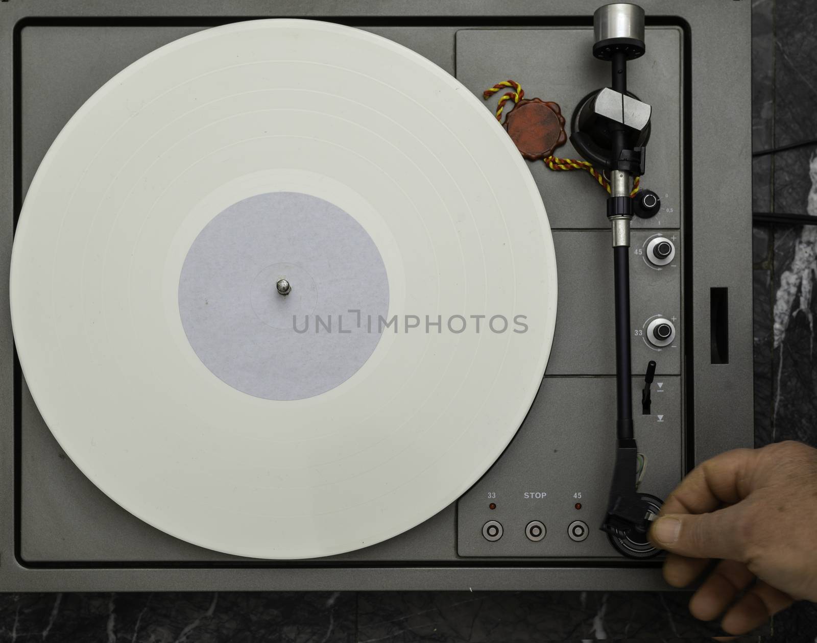 Vintage vinyl turntable with vinyl plate. Listen to music. Top view.