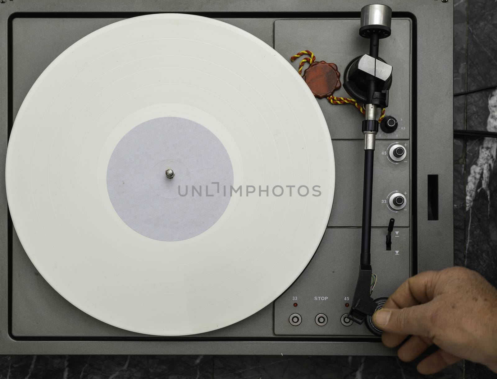 Vintage vinyl turntable with vinyl plate. Listen to music. Top view.