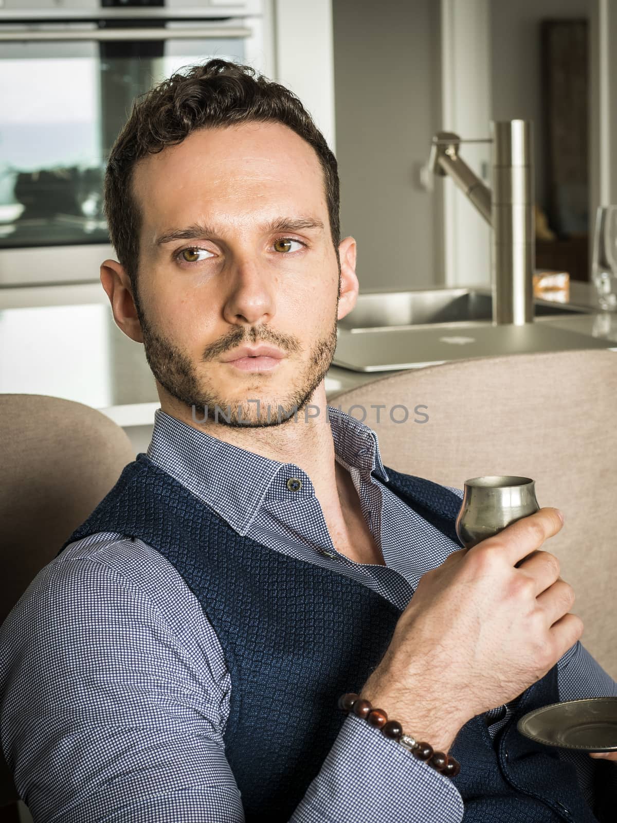 Handsome Man Drinking Coffe from Metal Cup While Sitting Comfortably at Home
