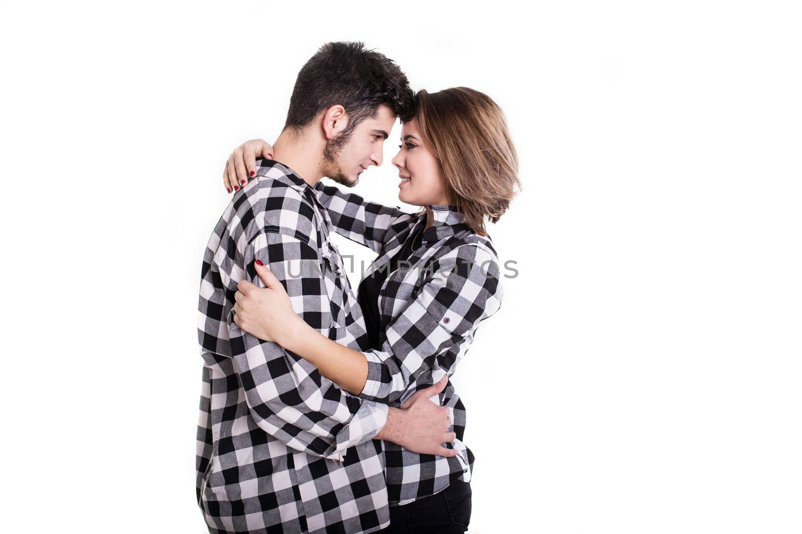 Happy young couple embracing each other isolated on white background