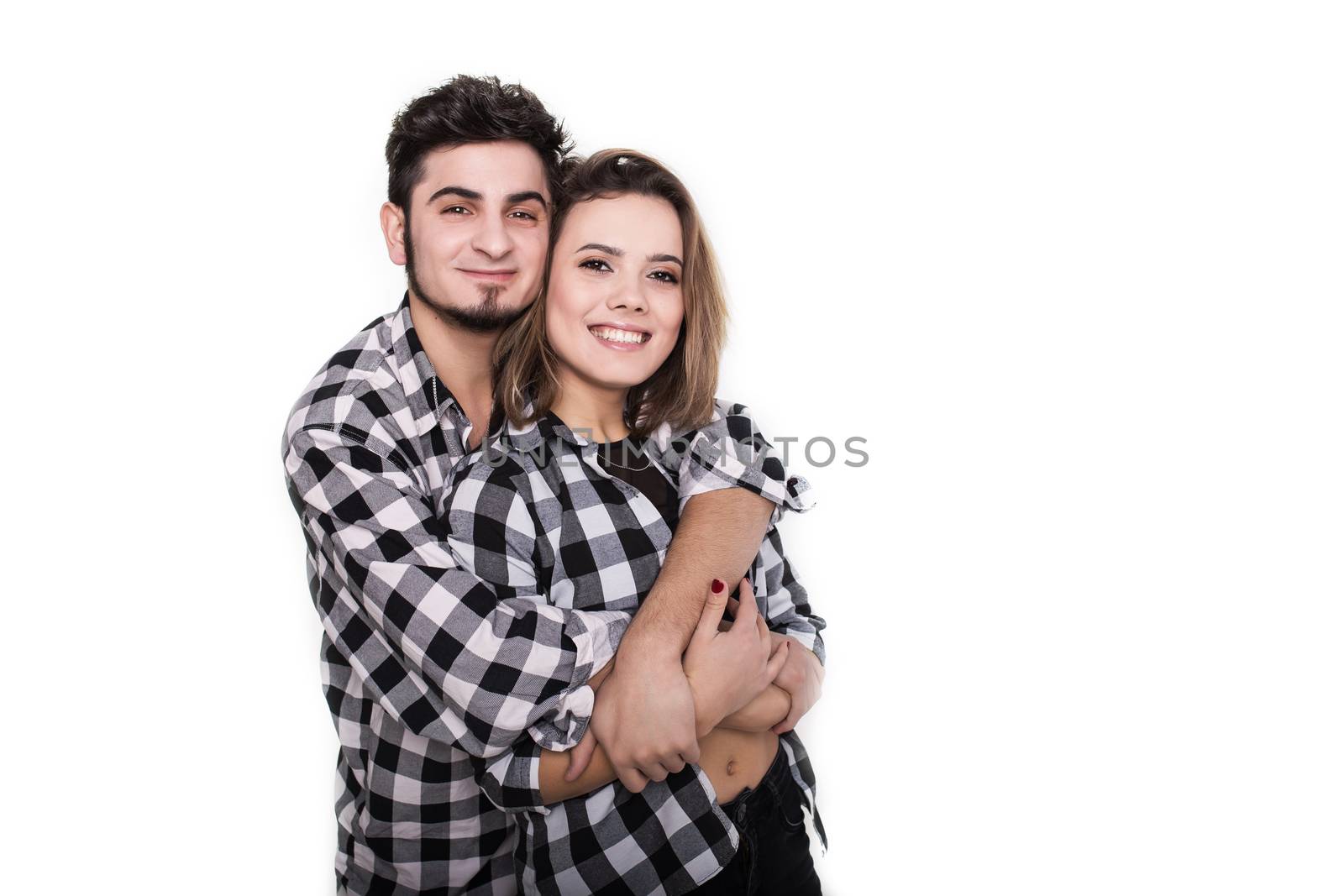 Happy young couple embracing each other isolated on white background