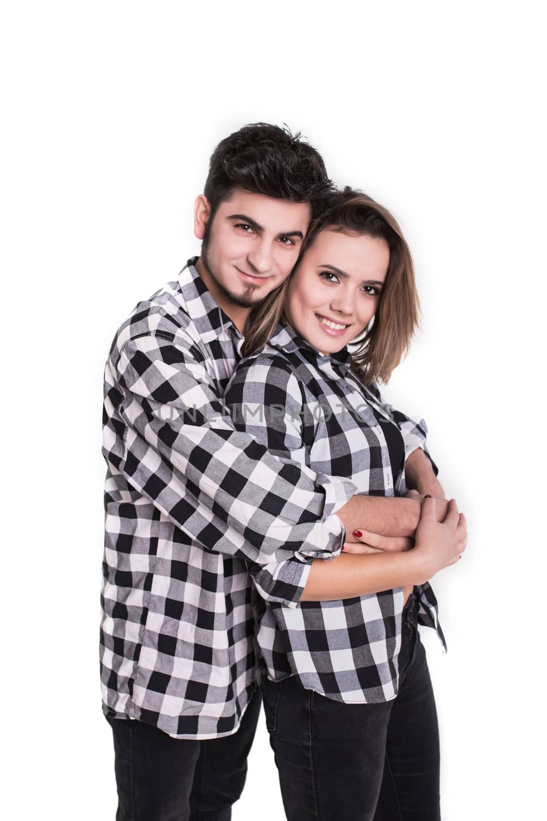 Happy young couple embracing each other isolated on white background