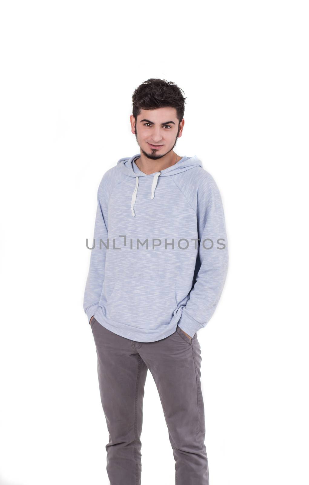 Young man standing hands in posket isolated on white