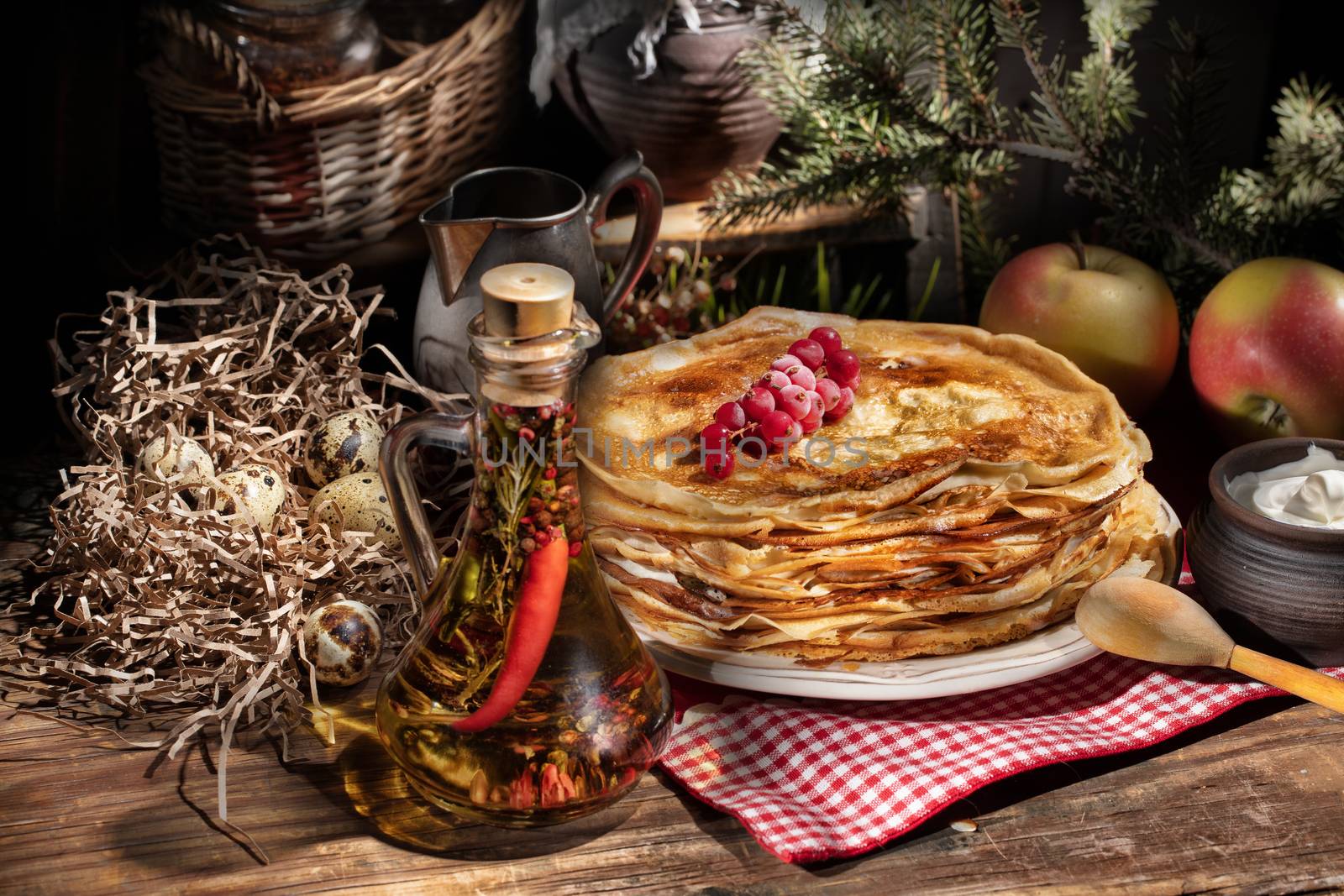 Plate with pancakes on an old wooden background