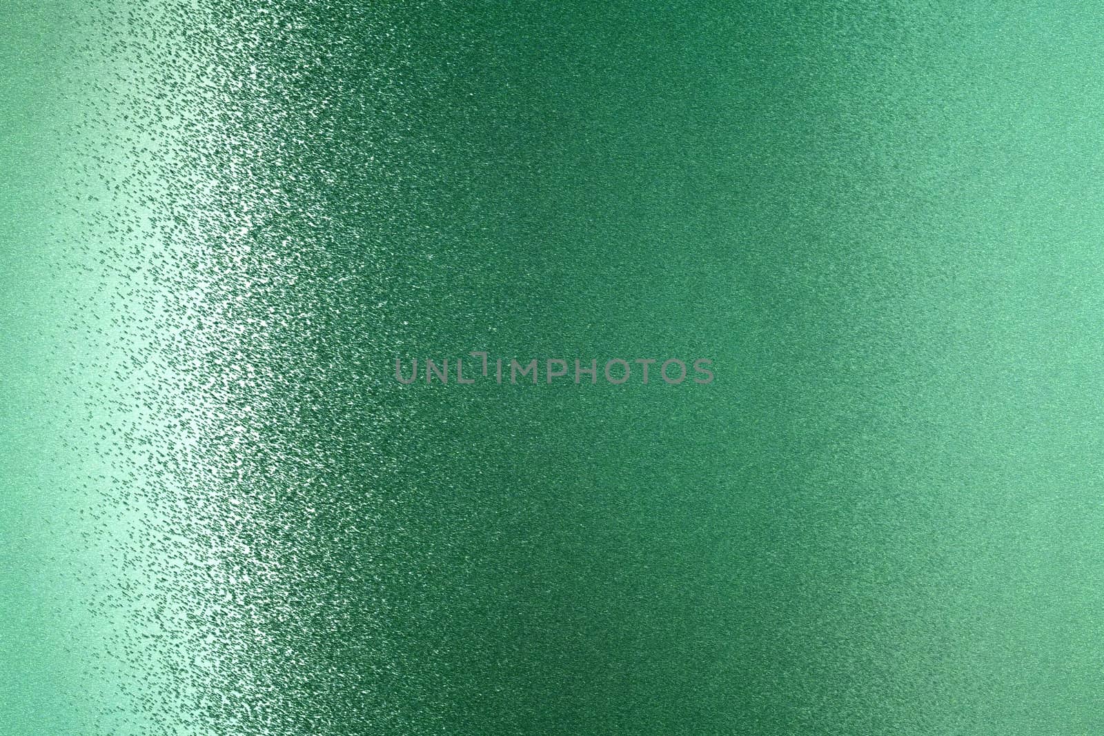 Glowing green metallic wall, abstract texture background