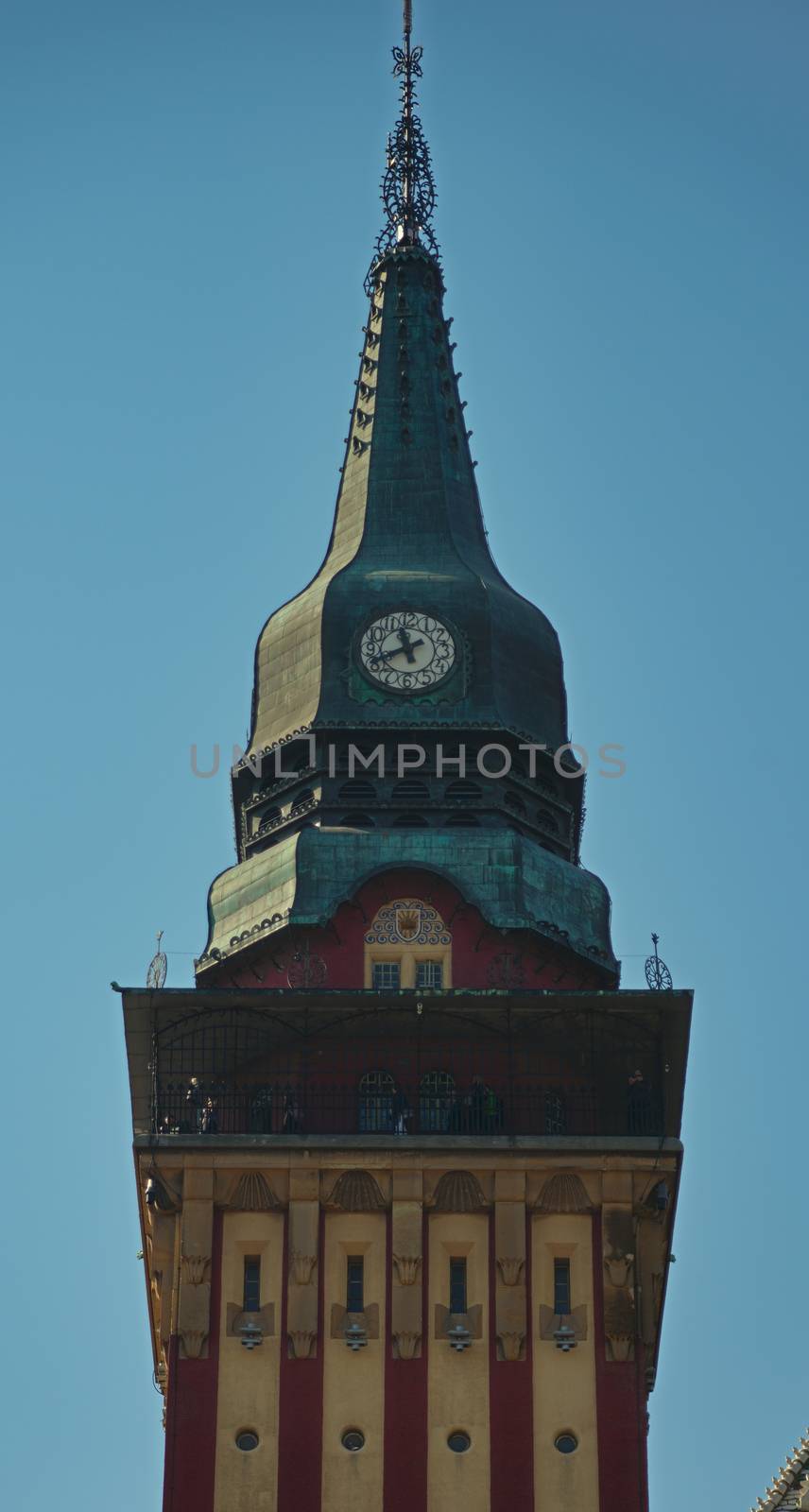 Top of the tower with a clock on a catholic church by sheriffkule