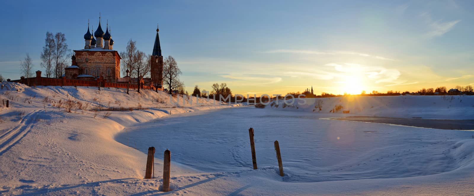 Beautiful landscape of Dunilovo village church and  sunrise panorama