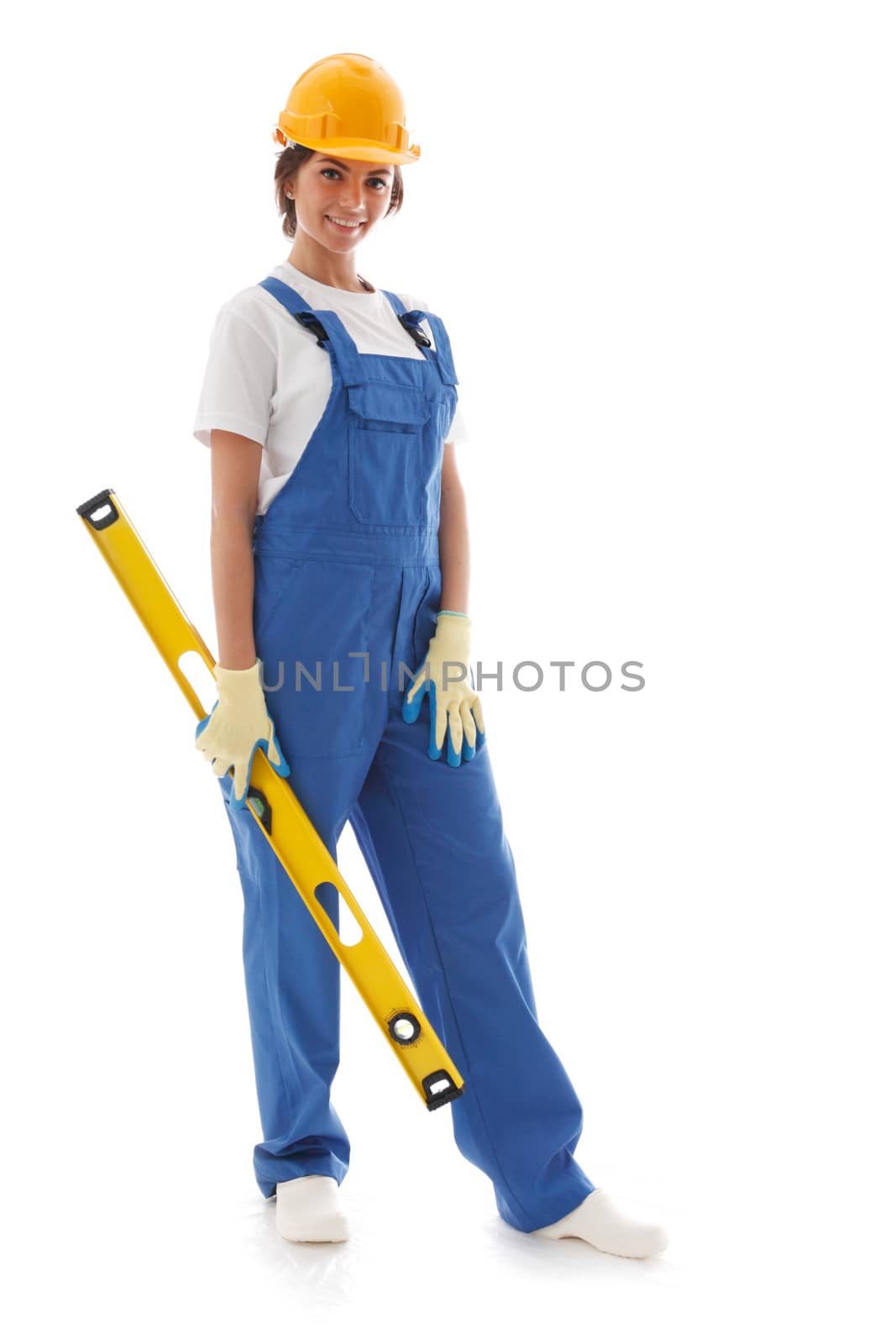 Young beautiful handywoman with building level isolated on white