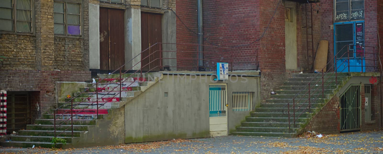 Two concrete stairways on a rustic urban building